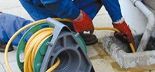 Jetting debris from a drain